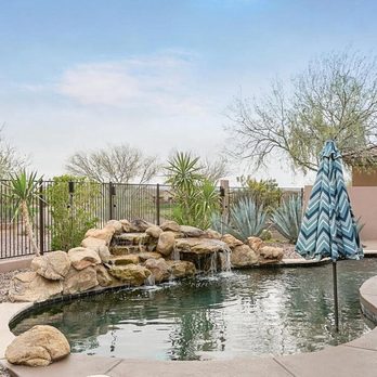 West Coast Pool Construction - a pool with a waterfall - Landscaping Near Me West Coast Pool Construction - a pool with a waterfall - Landscaping Near Me