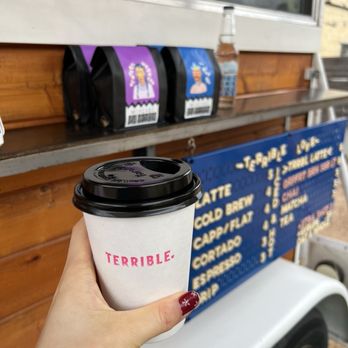 Terrible Love - a hand holding a cup of coffee - Coffee & Tea Near Me - Austin, Texas Terrible Love - a hand holding a cup of coffee - Coffee & Tea Near Me - Austin, Texas