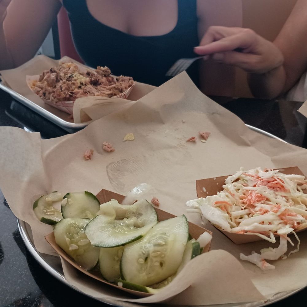 Big Mike’s BBQ - Plain pulled chicken in tray furthest away, with cucumbers and Cole slaw - Barbeque Near Me - Pittsboro, North Carolina Big Mike’s BBQ - Plain pulled chicken in tray furthest away, with cucumbers and Cole slaw - Barbeque Near Me - Pittsboro, North Carolina