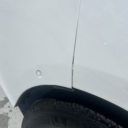 Collision Masters - Unaligned and unfitted bumper with chipped paint.
