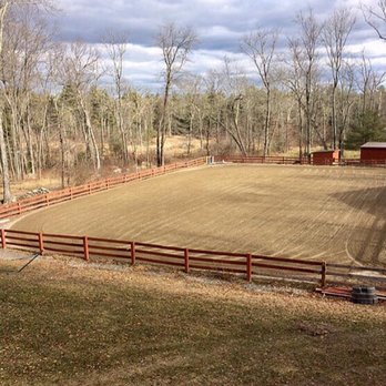Whispering Pine Acres - The 140x90 foot sand riding ring is fully lit, equipped with speakers, and a small jump course. - Horseback Riding Near Me - Dighton, Massachusetts Whispering Pine Acres - The 140x90 foot sand riding ring is fully lit, equipped with speakers, and a small jump course. - Horseback Riding Near Me - Dighton, Massachusetts