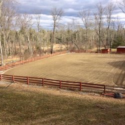 Whispering Pine Acres - The 140x90 foot sand riding ring is fully lit, equipped with speakers, and a small jump course.