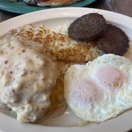 Biscuits and Gravy: Two homemade biscuits smothered in our country-style sausage gravy, two eggs any style, sausage and hashbrowns.