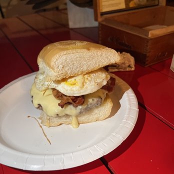 Frita's - Gaucho Burger $12.95 Beef patty, with chimi churri, onion, cheese, bacon, fried egg, on a Cuban bread roll with a side of guava ketchup - Cuban Near Me - Key West, Florida Frita's - Gaucho Burger $12.95 Beef patty, with chimi churri, onion, cheese, bacon, fried egg, on a Cuban bread roll with a side of guava ketchup - Cuban Near Me - Key West, Florida