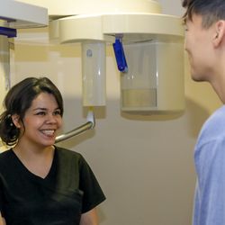 Sunny Smile Dental - Team examining patient