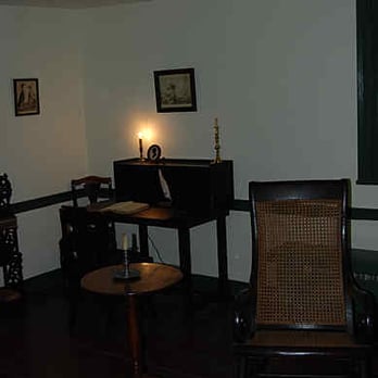 Poe Park - Poe Cottage interior - the writing desk and Poe's rocking chair - Parks Near Me - Bronx, New York Poe Park - Poe Cottage interior - the writing desk and Poe's rocking chair - Parks Near Me - Bronx, New York