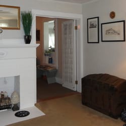 Maplewood Inn & Motel - The lounge with several well chosen accents, and the Inn's history on the wall.
