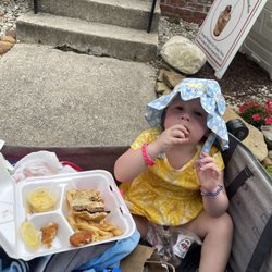 Artists Colony Inn - The baby eating leftover chicken fingers, fries, and her brothers cheeseburger!