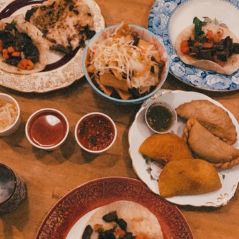 Casa Blanca - The yucca con chicharones, Colombian + Argentinian empanadas, pupusa mixta, and taco de carne. SO good. - Latin American Near Me - London, Ontario