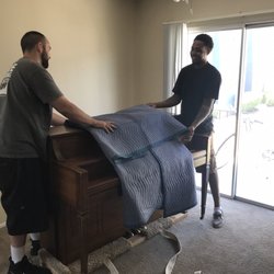 Encore Piano Moving - Dan and Spence making it easy work with a tight corner and a flight of stairs