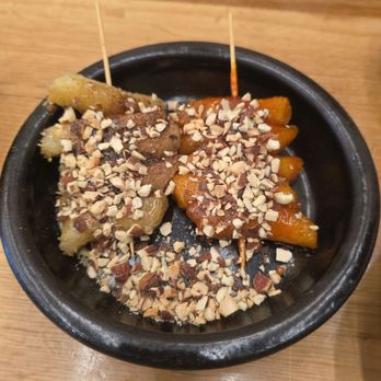 Han Sikdang - Half-and-half dduk skewers. Sweet honey/cinnamon with crunchy nuts on one side and a mildly spicy-sweet version on the other. - Korean Near Me - Aliso Viejo, California