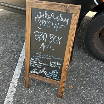 Smokin Taqueria - a chalk board with a menu on it - Food Trucks Near Me - Jacksonville, Florida