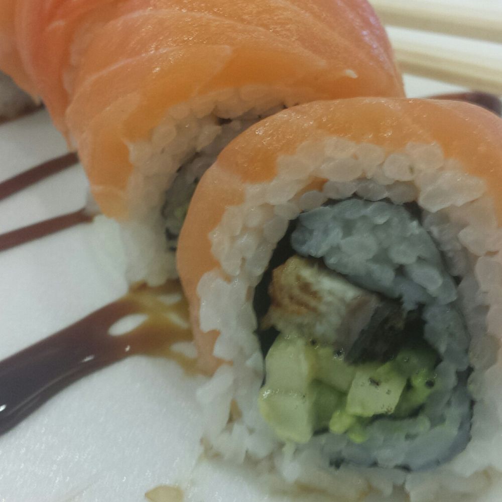 Sushi.Com - Closeup of pink dragon roll - Sushi Bars Near Me - Hicksville, New York Sushi.Com - Closeup of pink dragon roll - Sushi Bars Near Me - Hicksville, New York