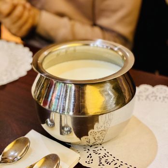 Kathiyawadi Kitchen - a bowl of milk and spoons - Indian Near Me - Sayreville, New Jersey Kathiyawadi Kitchen - a bowl of milk and spoons - Indian Near Me - Sayreville, New Jersey