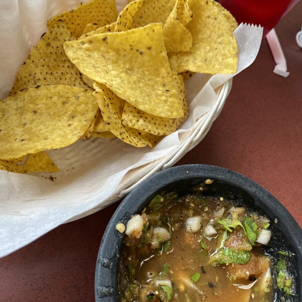 a bowl of soup and chips a bowl of soup and chips
