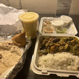Aloo bhindi, saag paneer, rasmalai, yogurt, samosa, mango lassi, chapati, rice, and sauces. Aloo bhindi, saag paneer, rasmalai, yogurt, samosa, mango lassi, chapati, rice, and sauces.