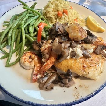 Landry's Seafood House - Pan seared Chilean Sea bass with Melissa on top. - Seafood Near Me - Orlando, Florida Landry's Seafood House - Pan seared Chilean Sea bass with Melissa on top. - Seafood Near Me - Orlando, Florida