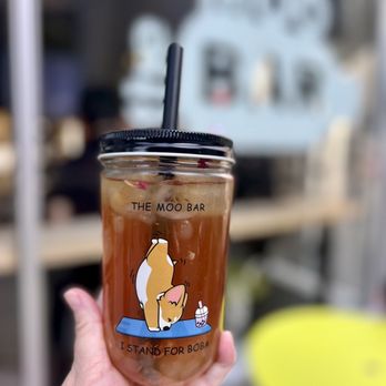 The Moo Bar - a hand holding a cup of iced coffee - Desserts Near Me - Seattle, Washington The Moo Bar - a hand holding a cup of iced coffee - Desserts Near Me - Seattle, Washington