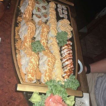 Blue Fin Japanese Restaurant - Sushi boat with a bunch of different rolls but mostly Volcano Roll - Sushi Bars Near Me - Middleton, Massachusetts Blue Fin Japanese Restaurant - Sushi boat with a bunch of different rolls but mostly Volcano Roll - Sushi Bars Near Me - Middleton, Massachusetts