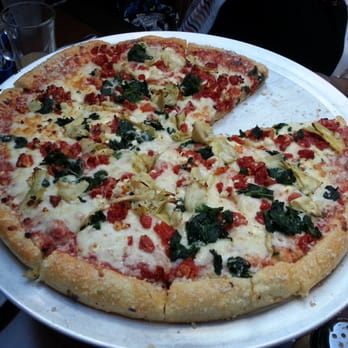 Aubree's Pizzeria & Grill - Tuscan pizza - with sun dried tomatoes, spinach, artichokes and feta - Pizza Near Me - Grand Blanc, Michigan Aubree's Pizzeria & Grill - Tuscan pizza - with sun dried tomatoes, spinach, artichokes and feta - Pizza Near Me - Grand Blanc, Michigan