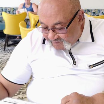 Crack'D Brunch - Papi is studying this menu. He knows what he wants - Breakfast & Brunch Near Me - New Orleans, Louisiana Crack'D Brunch - Papi is studying this menu. He knows what he wants - Breakfast & Brunch Near Me - New Orleans, Louisiana