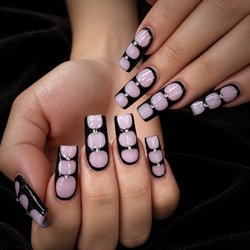 Pure Nails Spa - Soft lilac, bold black, and just the right touch of sparkle. A statement set made to stand out at Pure Nails Spa.