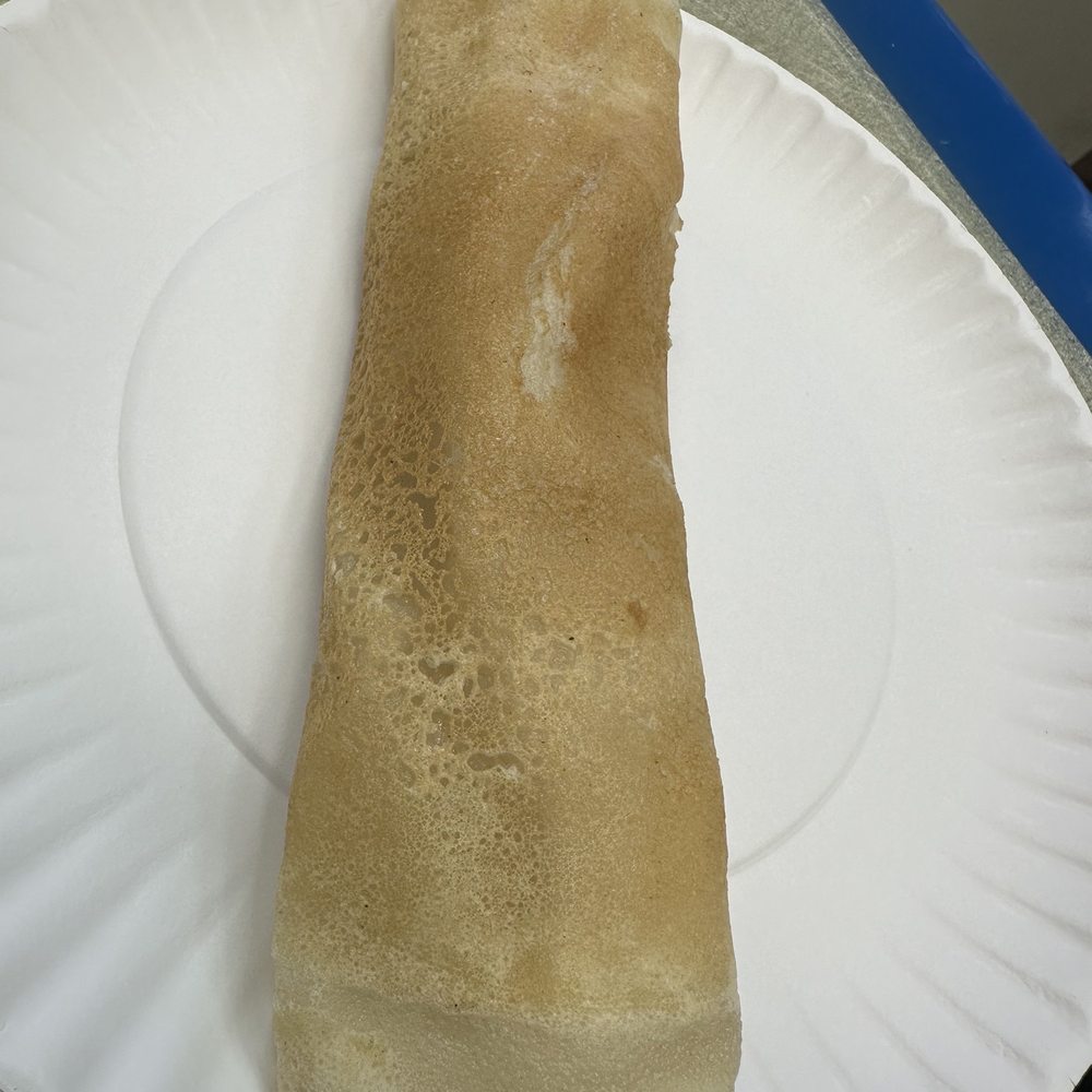 Abdullah Sweets and Restaurant - a piece of bread on a paper plate - Halal Near Me - Jackson Heights, New York