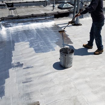 Aslam General Construction - Applying reflective aluminum silver coating on the flat roof. - Roofing Near Me