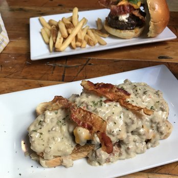 Station 2 - Fresh sausage gravy on the "Cure" burger! In the back the special Peach Burger - New American Near Me - Richmond, Virginia Station 2 - Fresh sausage gravy on the "Cure" burger! In the back the special Peach Burger - New American Near Me - Richmond, Virginia