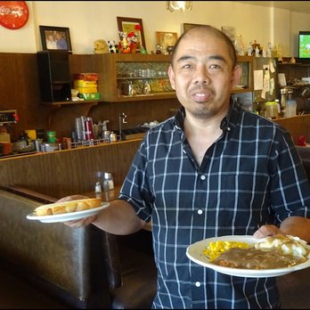 Village Cafe - Meet Ellis, my host, who brings my dinner with a smile.  Ellis is a great server, a great guy, and a true lover of football! - Chinese Near Me - Barstow, California