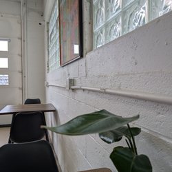 Tables along back wall have outlets for charging