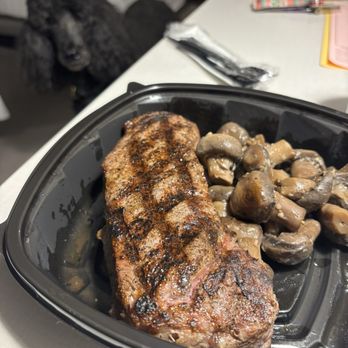 Nebraska's Rib & Chop House - New York strip, garlic mushrooms, and a poodle hoping to share the meal - Seafood Near Me - North Platte, Nebraska Nebraska's Rib & Chop House - New York strip, garlic mushrooms, and a poodle hoping to share the meal - Seafood Near Me - North Platte, Nebraska