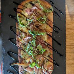 The Bookmark - Delicious pesto prosciutto flatbread.