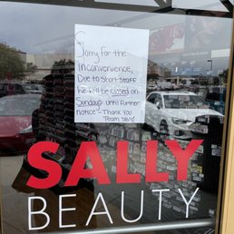 Exterior outside entrance of Sally Beauty - A hand written note saying they're closed. Who does that?? - Sand City, California Exterior outside entrance of Sally Beauty - A hand written note saying they're closed. Who does that?? - Sand City, California