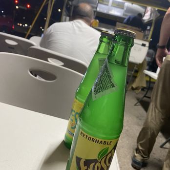 Dany Hot Dogs - Cooler with drinks, tables, a tarp tent cover, and pretty nice night to eat outside - Food Trucks Near Me - Tucson, Arizona