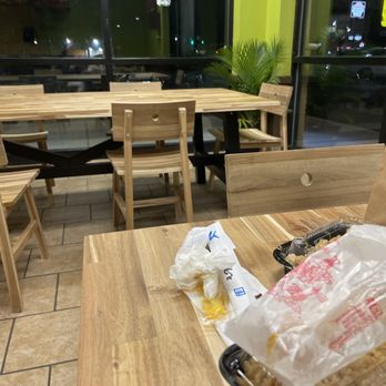 Crazy Kitchen - a wooden table with a bag of food on it - Chinese Near Me - Jacksonville, Florida