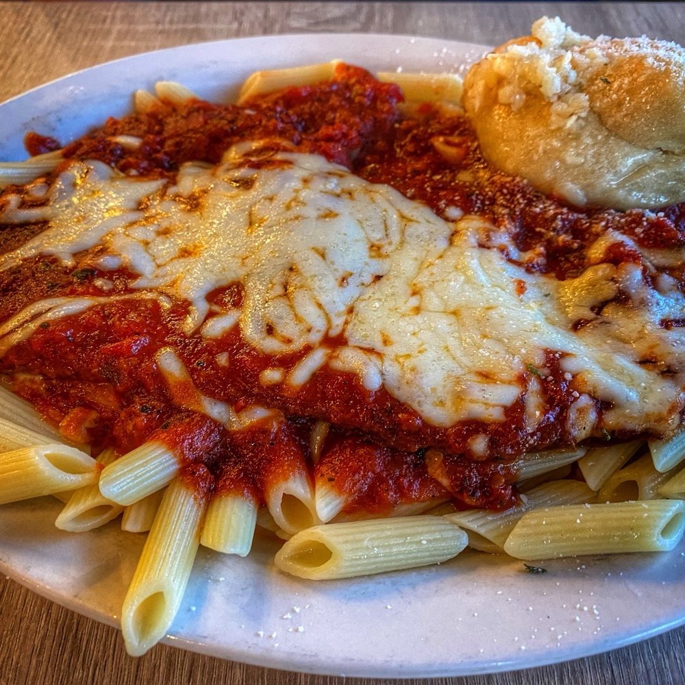 Mike's Pizza and Pub - Eggplant Parmigiana eggplant , marinara sauce over penne pasta w/garlic knot - Pizza Near Me - Largo, Florida Mike's Pizza and Pub - Eggplant Parmigiana eggplant , marinara sauce over penne pasta w/garlic knot - Pizza Near Me - Largo, Florida