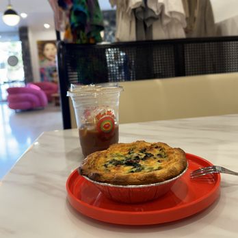 Hot Lips Coffee Shop - Spinach quiche and iced Americano with vibes in the background - Coffee & Tea Near Me - Cathedral City, California Hot Lips Coffee Shop - Spinach quiche and iced Americano with vibes in the background - Coffee & Tea Near Me - Cathedral City, California