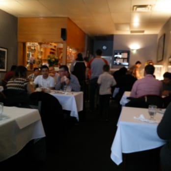 Clay Oven Restaurant - diners sitting at tables - Indian Near Me - Calgary, Alberta