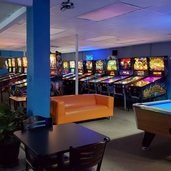 IPinball - a game room with a pool table and arcade machines - Comfort Food Near Me - Tavares, Florida