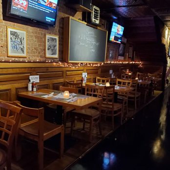 The Black Sheep - a restaurant with wooden tables and chairs - Irish Near Me - New York, New York The Black Sheep - a restaurant with wooden tables and chairs - Irish Near Me - New York, New York