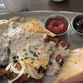 Ondus on the Waterfront - Kielbasa Sausage scramble with fresh potatoes, grilled onions, sausage gravy and eggs. Amazing!!! - American Near Me - Vancouver, Washington Ondus on the Waterfront - Kielbasa Sausage scramble with fresh potatoes, grilled onions, sausage gravy and eggs. Amazing!!! - American Near Me - Vancouver, Washington