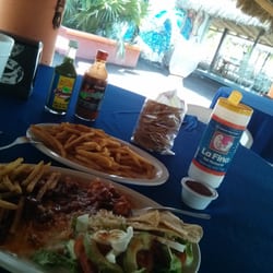 Restaurante Tsunami - Pulpo a la diabla con papas, y agua de piña con mango