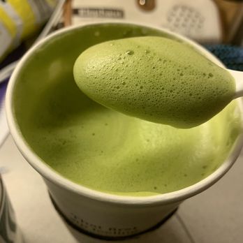 Starbucks - Foam from remake. Using a spoon to scoop out the foam. - Coffee & Tea Near Me - Riverside, California