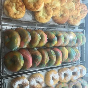 Amazing Bagel - a variety of doughnuts on racks - Bagels Near Me - Ocean Township, New Jersey