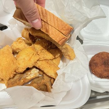 Marvin's Seafood - Six pieces of fish with two slices of bread. Plenty of sauce and crab cake. - Seafood Near Me - North Charleston, South Carolina Marvin's Seafood - Six pieces of fish with two slices of bread. Plenty of sauce and crab cake. - Seafood Near Me - North Charleston, South Carolina