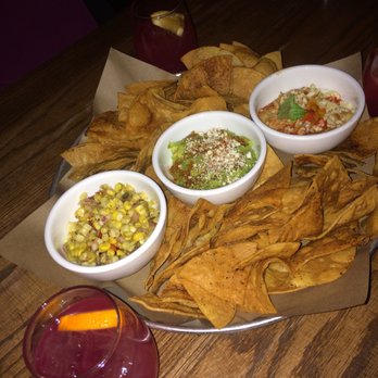 La Carnita - Chips with three dips: guacamole, corn salsa and spicy bean and queso - Mexican Near Me - Toronto, Ontario La Carnita - Chips with three dips: guacamole, corn salsa and spicy bean and queso - Mexican Near Me - Toronto, Ontario