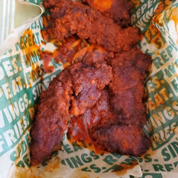 Wingstop - a tray of chicken wings with sauce and ketchup - Chicken Wings Near Me - Chino Hills, California Wingstop - a tray of chicken wings with sauce and ketchup - Chicken Wings Near Me - Chino Hills, California