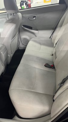 Photo of Phoenix Auto Detailing - Aurora, CO, US. Cleaned back seat of a Toyota Prius. The beautiful cream interior is on display.