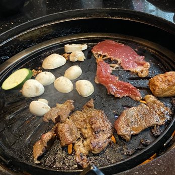 Chako - a variety of meats and vegetables on a grill - Asian Fusion Near Me - Scarborough, Ontario